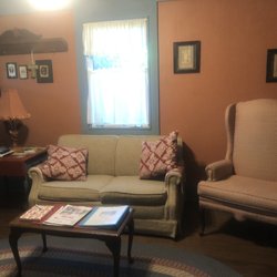 Cajun Country Cottages Bed & Breakfast - Magenta living room with pullout couch