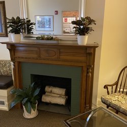 Oasis Guest House - Fireplace in breakfast area
