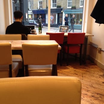 TY Seven Dials - Timberyard - Upstairs window view....retro red dining chair - Coffee & Tea Near Me - London, XGL