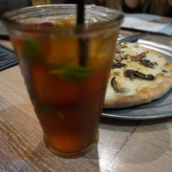 Moku Kitchen - Primms! Strawberry type of drink with the mushroom pizza - Cocktail Bars Near Me - Honolulu, Hawaii
