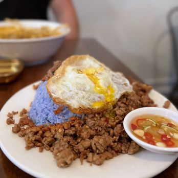 Mama Mu's Bistro - Bangkok (Pad Krapow): Stir-fried pork w/ chili, holy basil, fried egg, blue jasmine rice | $15 - Thai Near Me - San Francisco, California Mama Mu's Bistro - Bangkok (Pad Krapow): Stir-fried pork w/ chili, holy basil, fried egg, blue jasmine rice | $15 - Thai Near Me - San Francisco, California