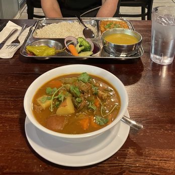 Wildberry Restaurant - Channa thali (background), Himalayan Sherpa Stew (foreground) - American Near Me - Ashford, Washington Wildberry Restaurant - Channa thali (background), Himalayan Sherpa Stew (foreground) - American Near Me - Ashford, Washington