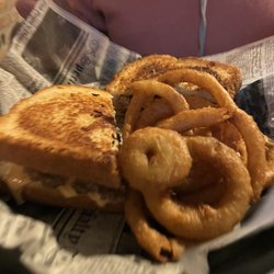 4 Below HAGGY’S BAR & GRILL - Double Decker Patty Melt with a side of Onion Rings.