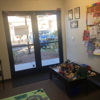 Motivated Kids Therapy - Section of waiting area. That wooden train track is fun to play with... for kids to play with I mean. - Occupational Therapy Near Me - Las Vegas, Nevada