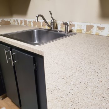 Legacy All Surface - a kitchen counter with a sink - General Contractors Near Me