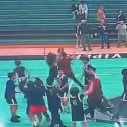 Hoop Dreams of America - This photo shows the assistant coach flipping and waving at the parents . He allowed his team to do the same and yet cause and altercation.