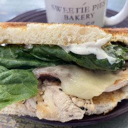 Chicken bacon lettuce tomato cheese sandwich on toasted sour dough bread Chicken bacon lettuce tomato cheese sandwich on toasted sour dough bread
