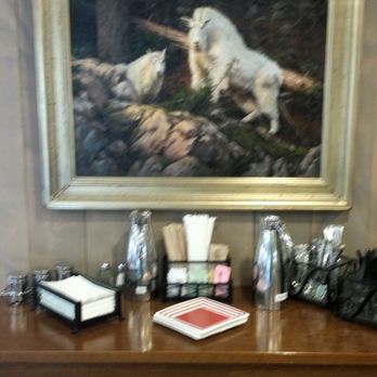 Dixie's Coffee House - Condiment table. Note: no plastic creamer cups. Tasteful cream & milk servers. - Coffee & Tea Near Me - Manitowish Waters, Wisconsin