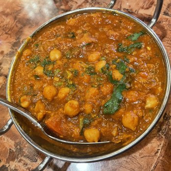 Mantra - a bowl of curry with a spoon in it - Indian Near Me - Corona, California