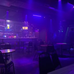 a bar with purple lighting