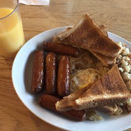 My meal, orange juice to drink. Two eggs, over hard. Whole wheat toast, and five sausages! My meal, orange juice to drink. Two eggs, over hard. Whole wheat toast, and five sausages!