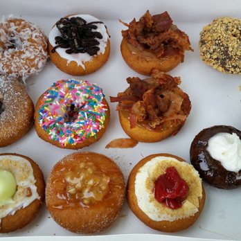Amazing Glazed - Amazing dozen with 2 maple bacons... they gave me an extra one because the donuts were running small. YUM! - Donuts Near Me - Chesapeake, Virginia