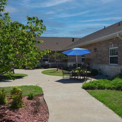 Chapters Living of Tulsa - The outdoor space includes covered tables and chairs for neighbors to visit at Chapters Living of Tulsa.