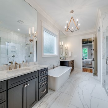 Homescapes Builders - a large bathroom with marble countertops - General Contractors Near Me - Raleigh, North Carolina