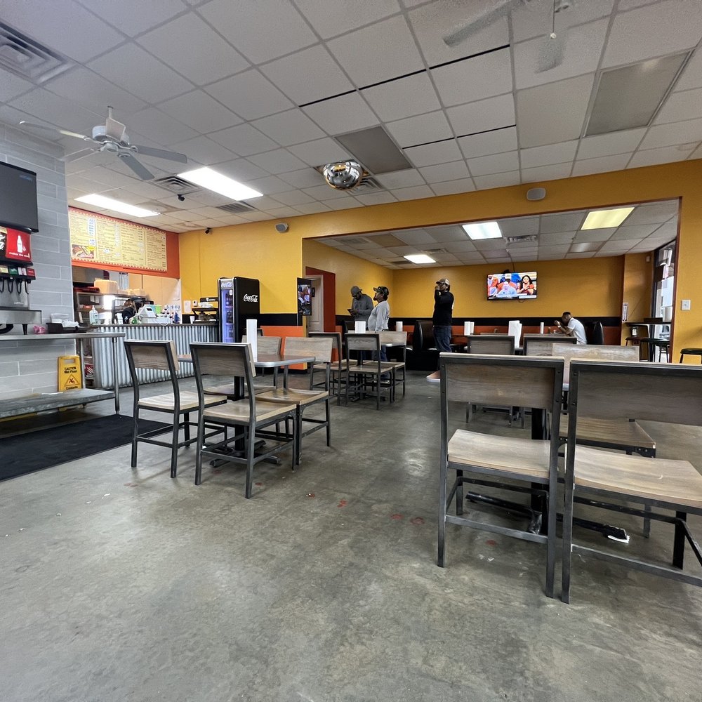 Plain Jane dining room, concrete floors and fluorescent lighting. Clean-ish
