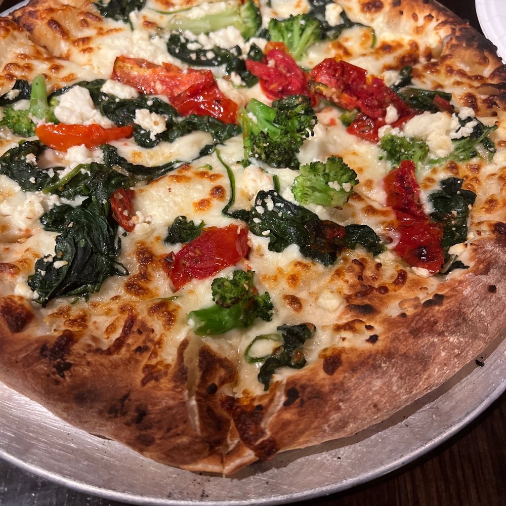 Tuque’s Bar and Grill - Spinaccoli - spinach, broccoli, roasted tomatoes, feta, EVOO. - American Near Me - Snowshoe, West Virginia Tuque’s Bar and Grill - Spinaccoli - spinach, broccoli, roasted tomatoes, feta, EVOO. - American Near Me - Snowshoe, West Virginia