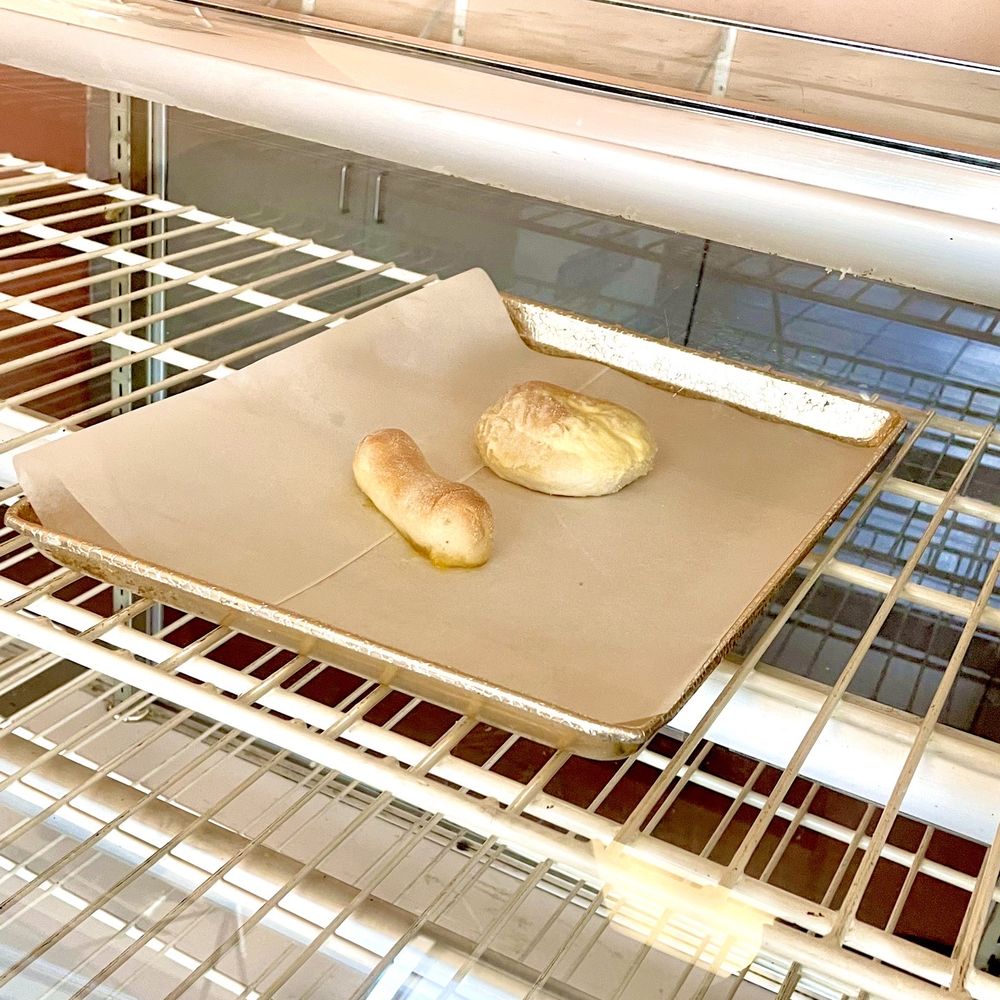 Behold this whopping case display for the entire bakery (Spanish bread and ensaymada) Behold this whopping case display for the entire bakery (Spanish bread and ensaymada)