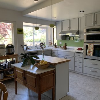 Clark Innovative - New floor and appliances with cabinets beautifully painted with top-quality paint. Chris custom built the oven cabinet with two drawers. - General Contractors Near Me Clark Innovative - New floor and appliances with cabinets beautifully painted with top-quality paint. Chris custom built the oven cabinet with two drawers. - General Contractors Near Me