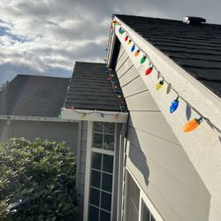 PDX Lawncare & Handyman - Hanging Christmas lights.