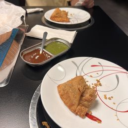 Chicken samosa - too delicious that I ate half before the pic. So sorry. The sauces that go with it are great. Chicken samosa - too delicious that I ate half before the pic. So sorry. The sauces that go with it are great.