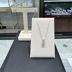Huntington Fine Jewelers - Diamond stud earrings and diamond pendant