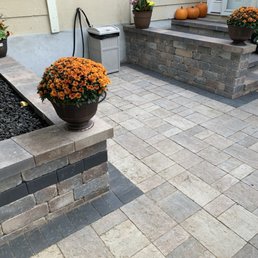 Patio retaining walls doubled as extra seats and built in lighting under steps and underneath of lip of retaining walls. Patio retaining walls doubled as extra seats and built in lighting under steps and underneath of lip of retaining walls.