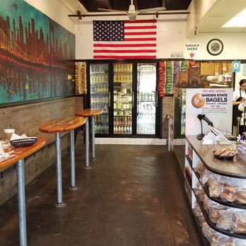 Garden State Bagels - Maximizing small space, 3 surfboard tables for eat in. - Bagels Near Me - Encinitas, California