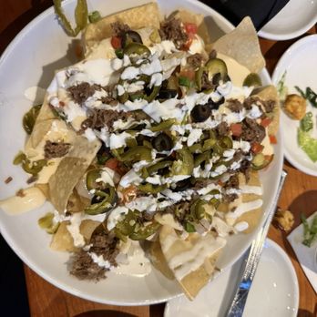 Rex's Bar & Grill - Loaded brisket nachos (appetizer) - Sports Bars Near Me - Fort Worth, Texas Rex's Bar & Grill - Loaded brisket nachos (appetizer) - Sports Bars Near Me - Fort Worth, Texas