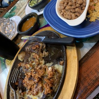 El Arriero - T-bone steak, covered by chorizo & shrimps. New beans to me w/rice & pico de gallo. Everything delicious! - Mexican Near Me - Midlothian, Virginia