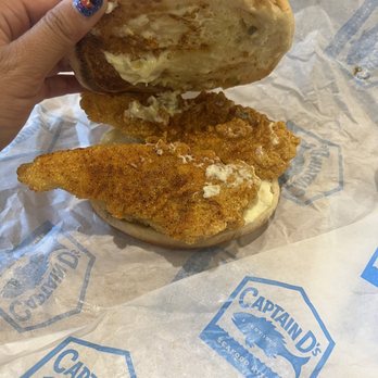 Captain D's - a hand holding a chicken sandwich - Seafood Near Me - Douglas, Georgia Captain D's - a hand holding a chicken sandwich - Seafood Near Me - Douglas, Georgia