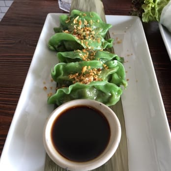 Kittiwat Thai Kitchen - Green Dumplings Spinach, taro, corn kernel, carrot and green peas served w/ black bean sauce (vegan) - Thai Near Me - Frederick, Maryland Kittiwat Thai Kitchen - Green Dumplings Spinach, taro, corn kernel, carrot and green peas served w/ black bean sauce (vegan) - Thai Near Me - Frederick, Maryland