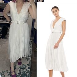 Sotelo's Alterations - Dress alterations: improved the neckline (made the neckline slightly less deep and more modest)