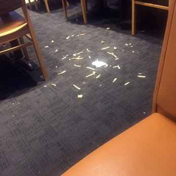 Buffalo Wild Wings - Yea. These nice customers were just sat right next to this floor full of fries. Really BWW? - American Near Me - Concord, California