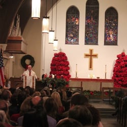 All Saints Episcopal Church - Father Rob gives a homily during Mass