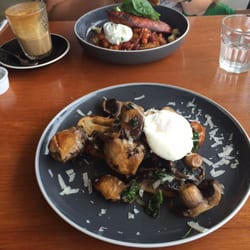 Big Sur Coffee - Mushroom, kales, poached egg on sourdough; baked beans, chorizo and poached egg in the background