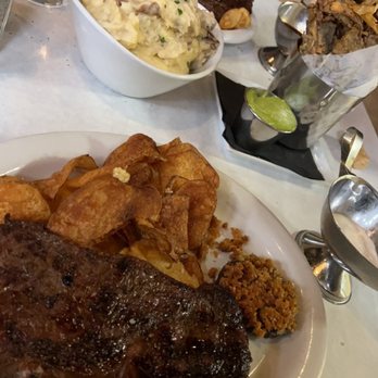 Echo & Rig - Rib-eye which comes witch chips and a mushroom cap (as do all steaks) Center is mashed potatoes and portobello fries we had as sides. - Steakhouses Near Me - Las Vegas, Nevada