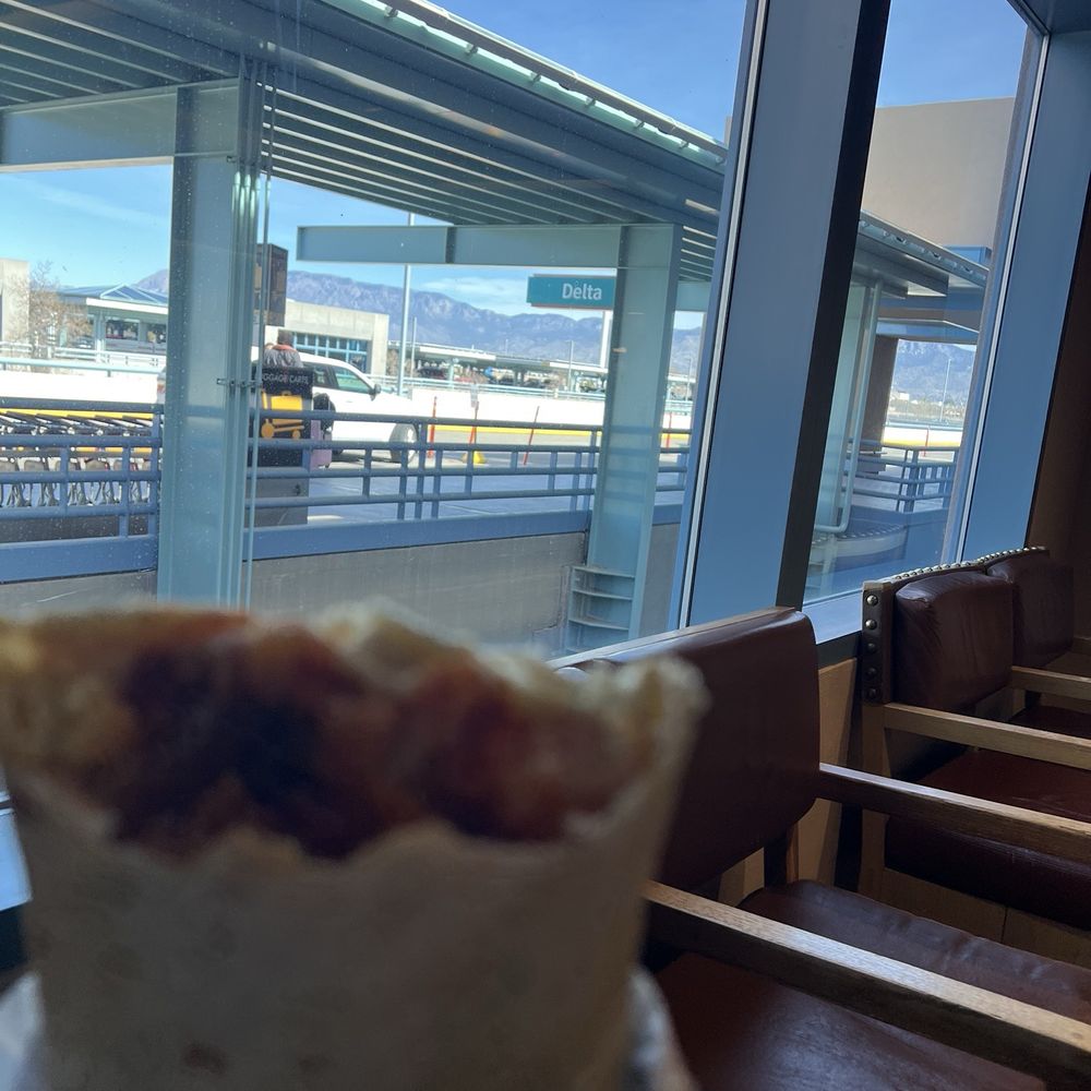 ABQ Burrito - My to go Morning Bacon Breakfast Burrito enjoying it before my flight back home - Mexican Near Me - Albuquerque, New Mexico