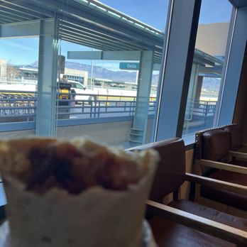 ABQ Burrito - My to go Morning Bacon Breakfast Burrito enjoying it before my flight back home - Mexican Near Me - Albuquerque, New Mexico