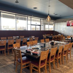 King Pot - Lots of seating + booths with built in table top BBQ and induction burners for individual hot pots.