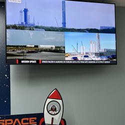 Space Beans Coffee - Tv screen w spaceship footage.