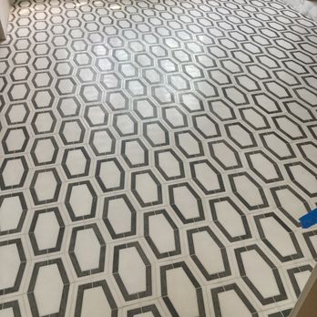 Soto Tile And Marble - a black and white pattern on the floor - Flooring Near Me