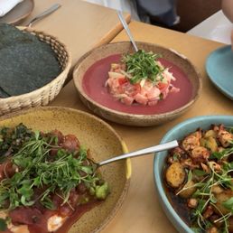 Tartar de atún on the left, Pulpo a la salsa macha on the right, and Ceviche de salmón con leche de tigre de jamaica on the top