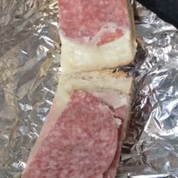 Moe'z Pizza - This is how the meat was placed throughout the Stromboli. One piece of cooked ham and two pieces of low-grade salami! Times on that hard