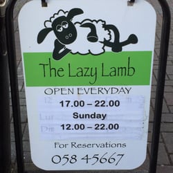The Lazy Lamb - Street sign. Restaurant is on the second floor.
