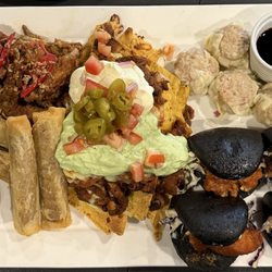 Chatswood Club - The Chatty Platter. Cheese Burger Spring Rolls, Korean Fried Chicken, Nachos, steamed dim sums, and charcoal bun bao fried chicken sliders.