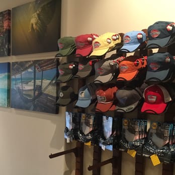 Tailwaters Fly Fishing - Great fly fishing pics, next to one of their hat racks, great design guys! - Fishing Near Me - Dallas, Texas