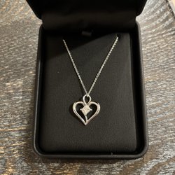 Reini Goldsmiths & Jewelers - 10k gold necklace with mounted diamond