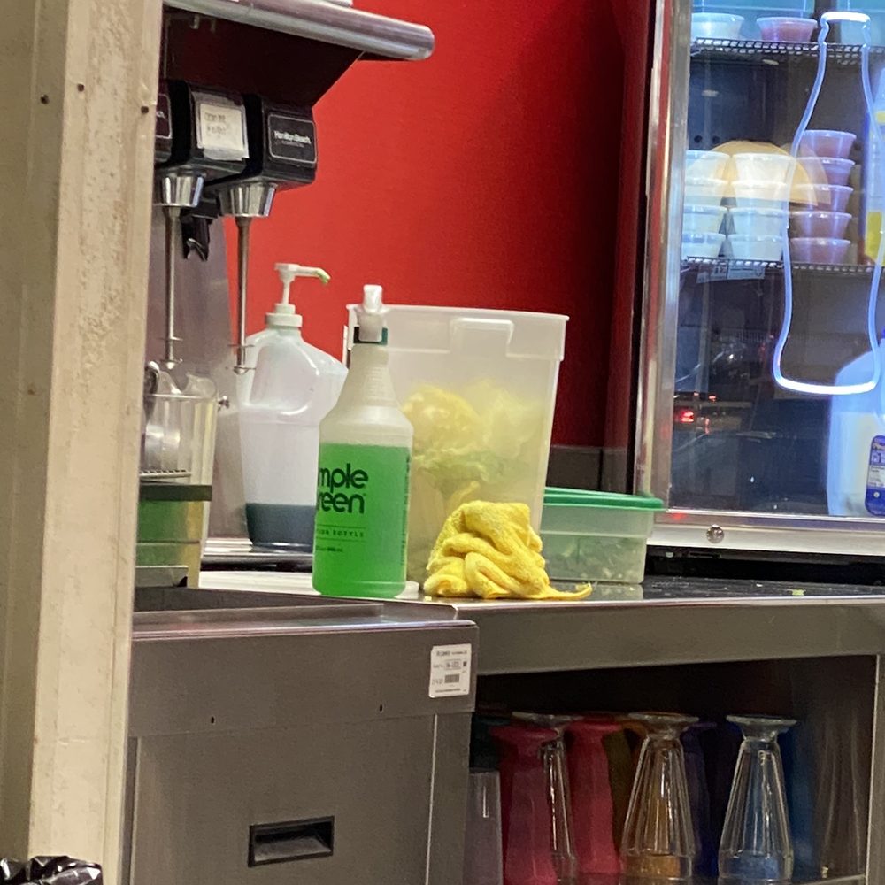 Why is this simple green so close to an open container of food? Why is this simple green so close to an open container of food?