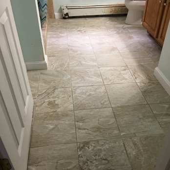 Conte Improvements & Remodeling - a bathroom with a tile floor - General Contractors Near Me Conte Improvements & Remodeling - a bathroom with a tile floor - General Contractors Near Me