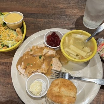 The Village Inn - Salad with honey mustard dressing, turkey and gravy, cranberry sauce, biscuit and butter, and chicken noodle soup. - Breakfast & Brunch Near Me - Oldsmar, Florida The Village Inn - Salad with honey mustard dressing, turkey and gravy, cranberry sauce, biscuit and butter, and chicken noodle soup. - Breakfast & Brunch Near Me - Oldsmar, Florida